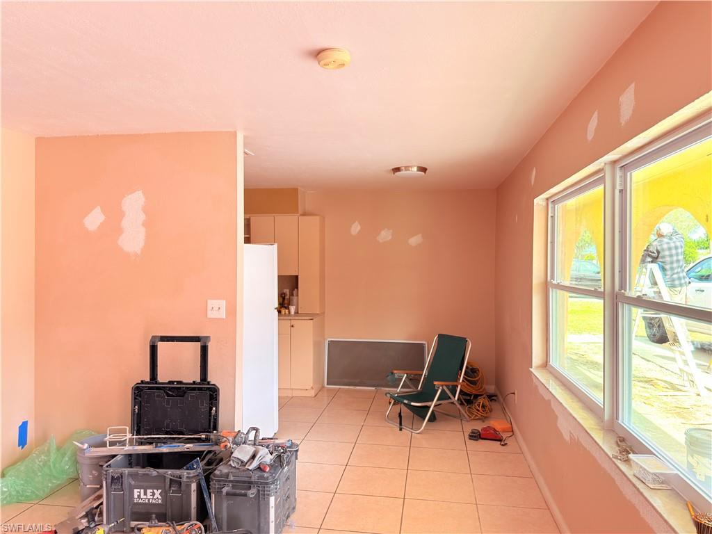 2241 Sunshine Boulevard Naples, FL 34116 - Photo 6 of 35 a living room with furniture and floor to ceiling window