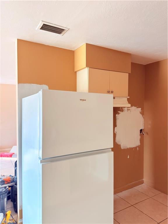 2241 Sunshine Boulevard Naples, FL 34116 - Photo 9 of 35 a white refrigerator freezer and a dishwasher sitting in a kitchen
