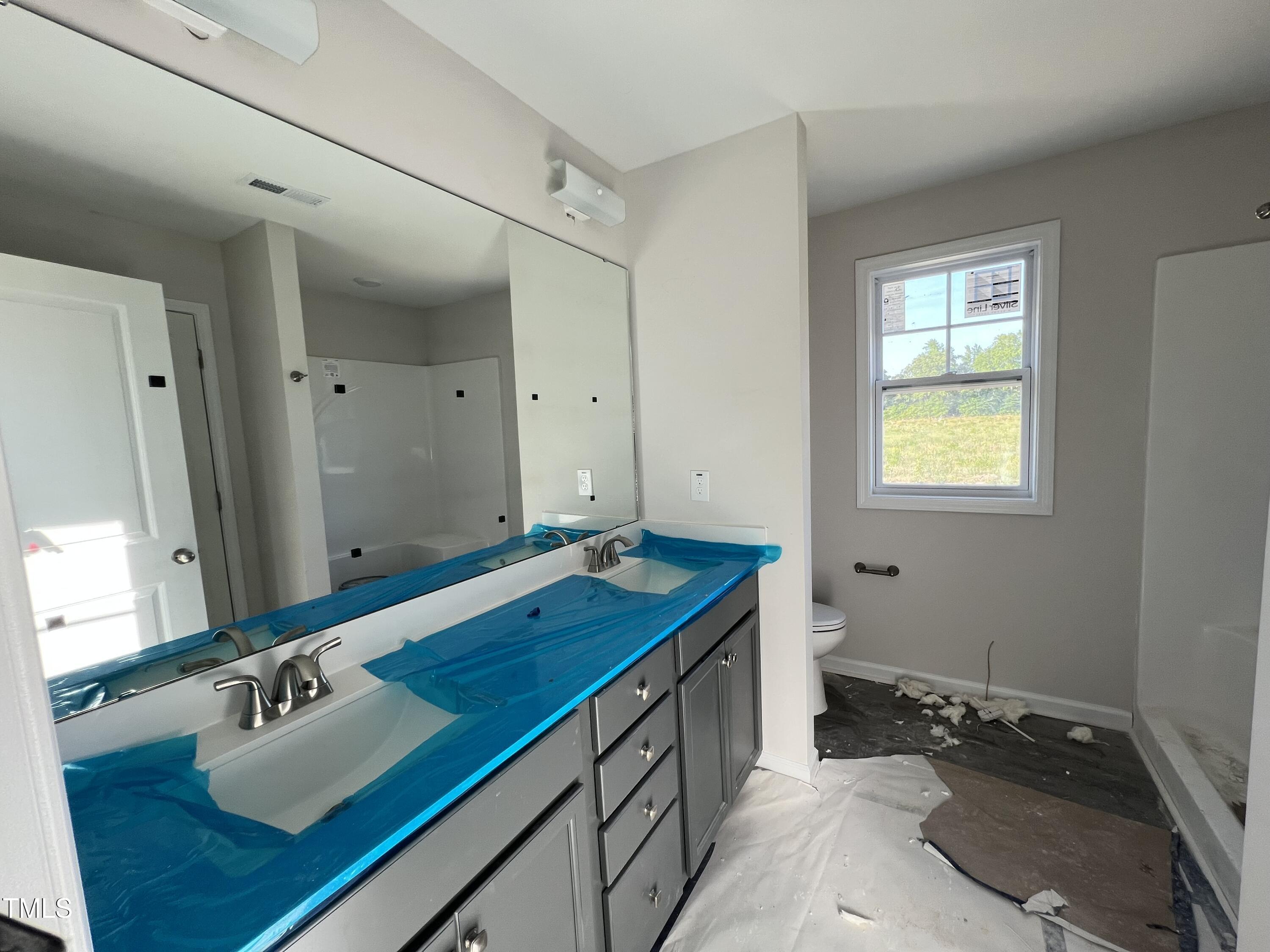 132 Dalton Drive Benson, NC 27504 - Photo 12 of 16 a bathroom with a sink and a mirror