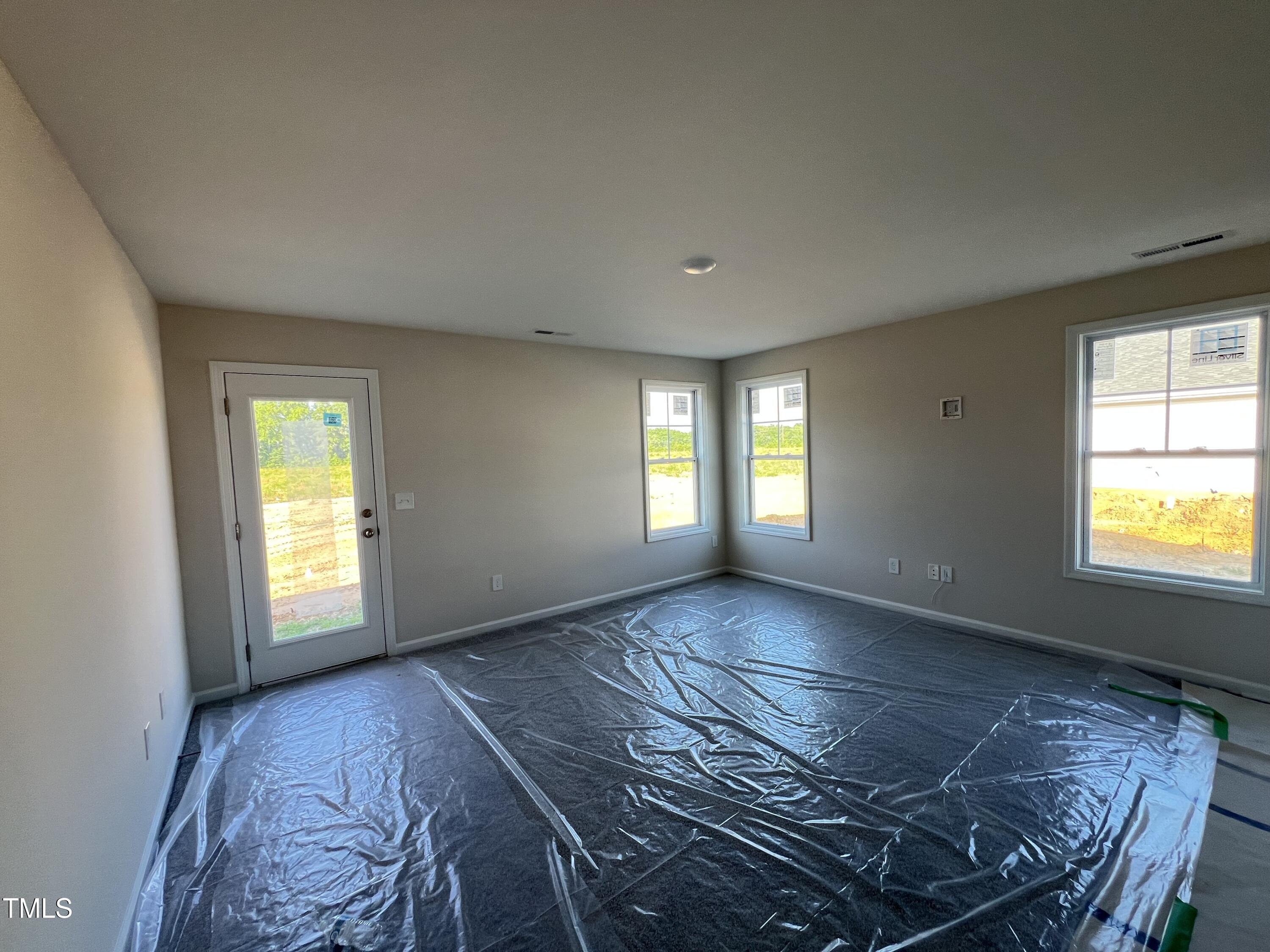 132 Dalton Drive Benson, NC 27504 - Photo 13 of 16 a view of an empty room and window
