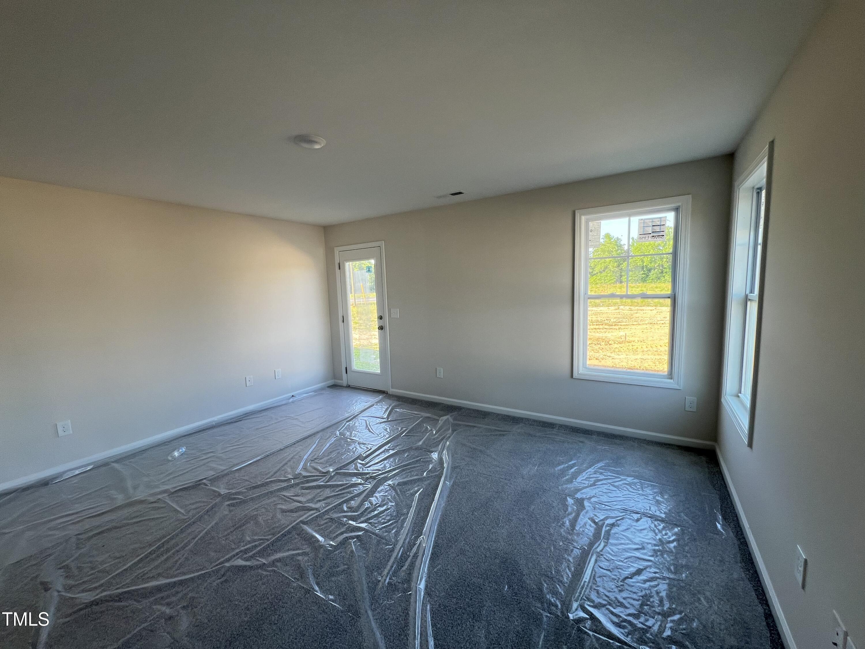 132 Dalton Drive Benson, NC 27504 - Photo 14 of 16 a view of an empty room and window