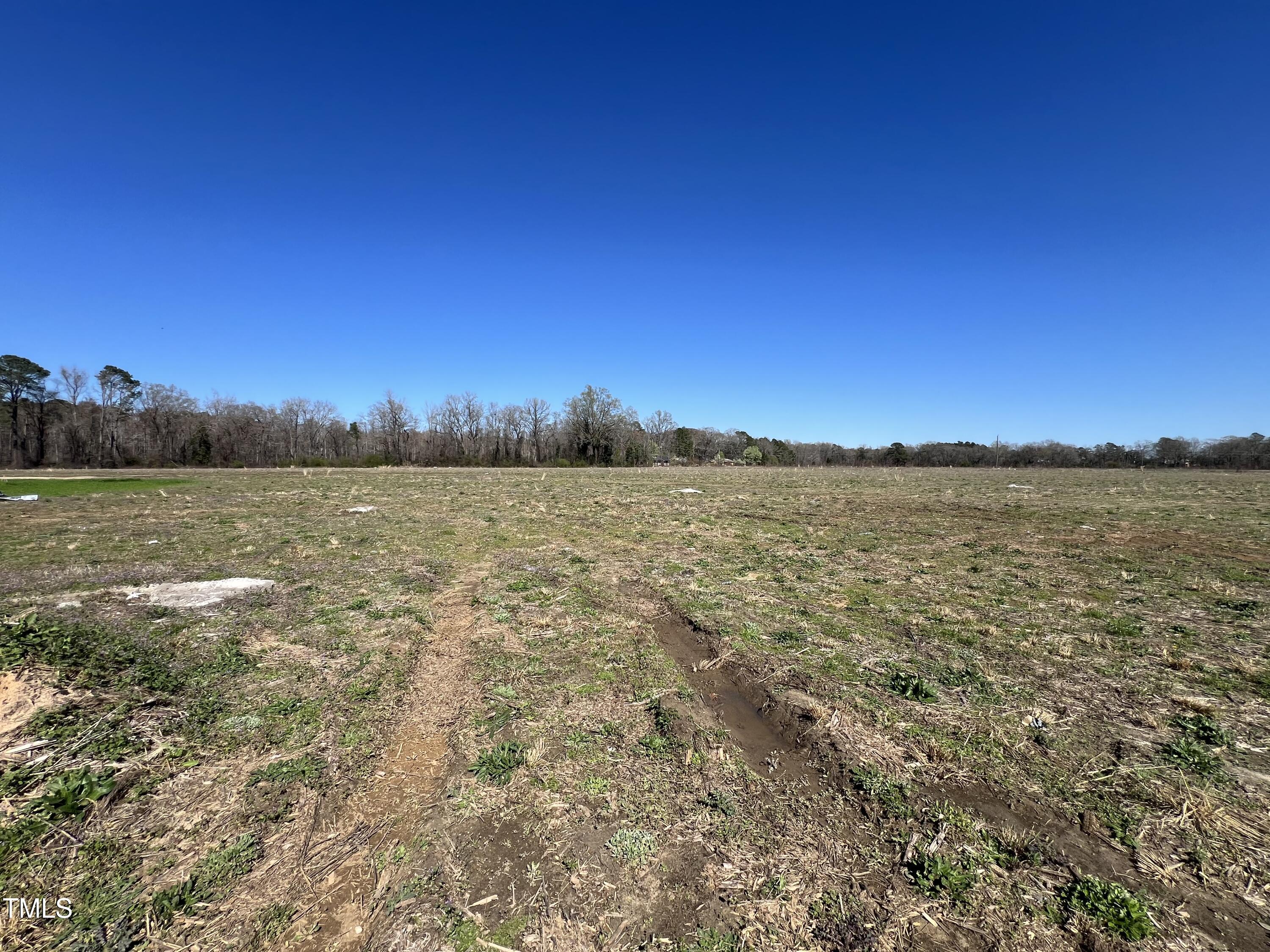 132 Dalton Drive Benson, NC 27504 - Photo 15 of 16 a view of a lake with sunset in background