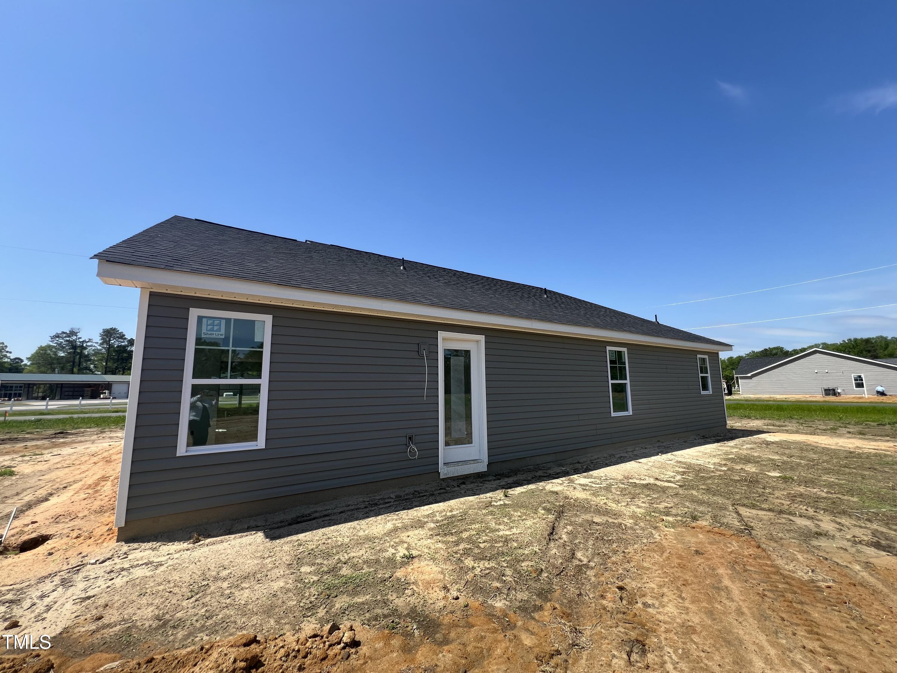 132 Dalton Drive Benson, NC 27504 - Photo 16 of 16 a front view of a house with a yard