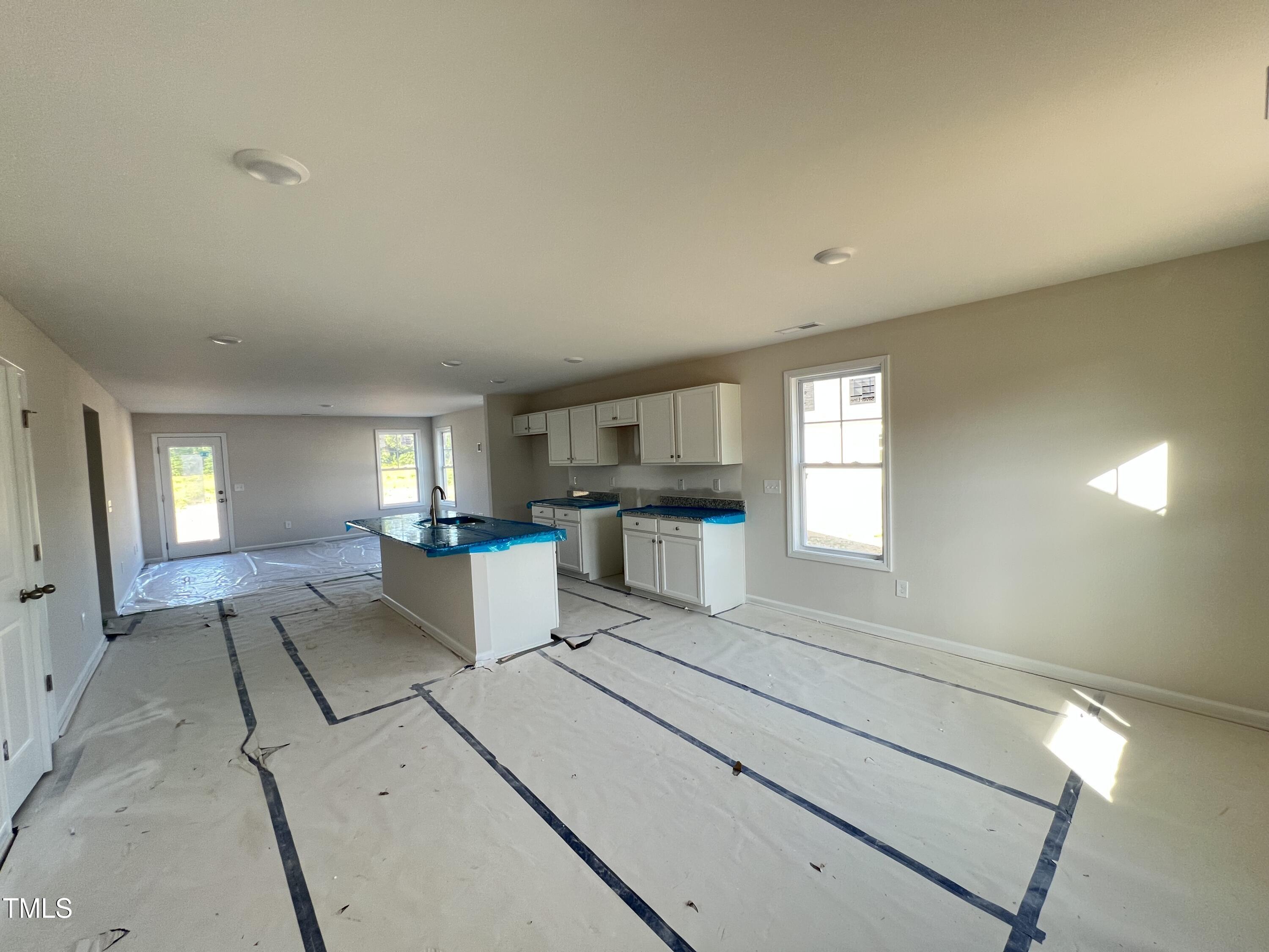 132 Dalton Drive Benson, NC 27504 - Photo 4 of 16 a view of a kitchen with furniture and windows