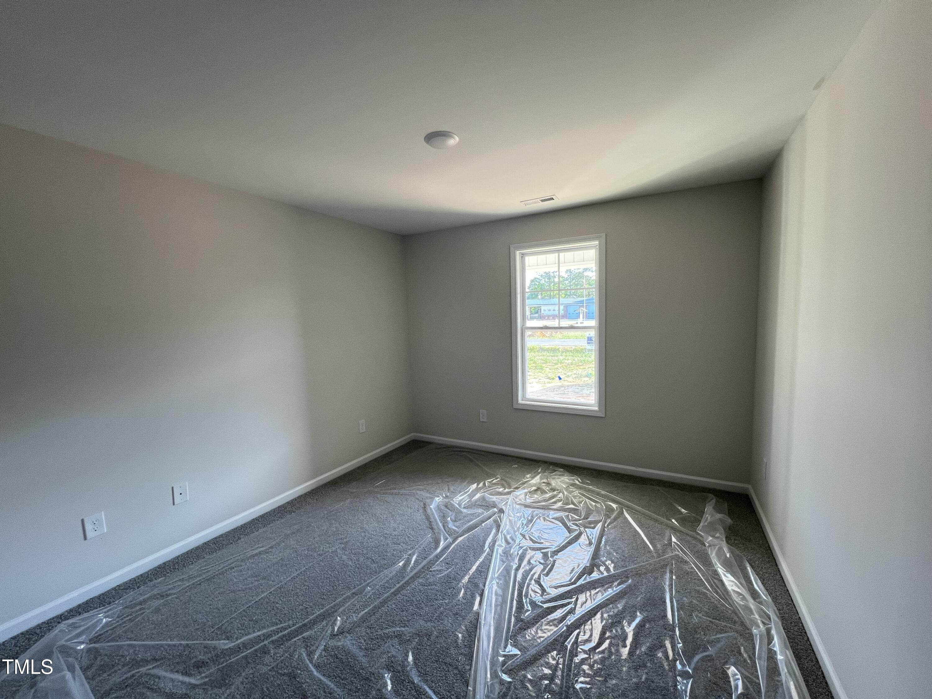 132 Dalton Drive Benson, NC 27504 - Photo 7 of 16 an empty room with a window