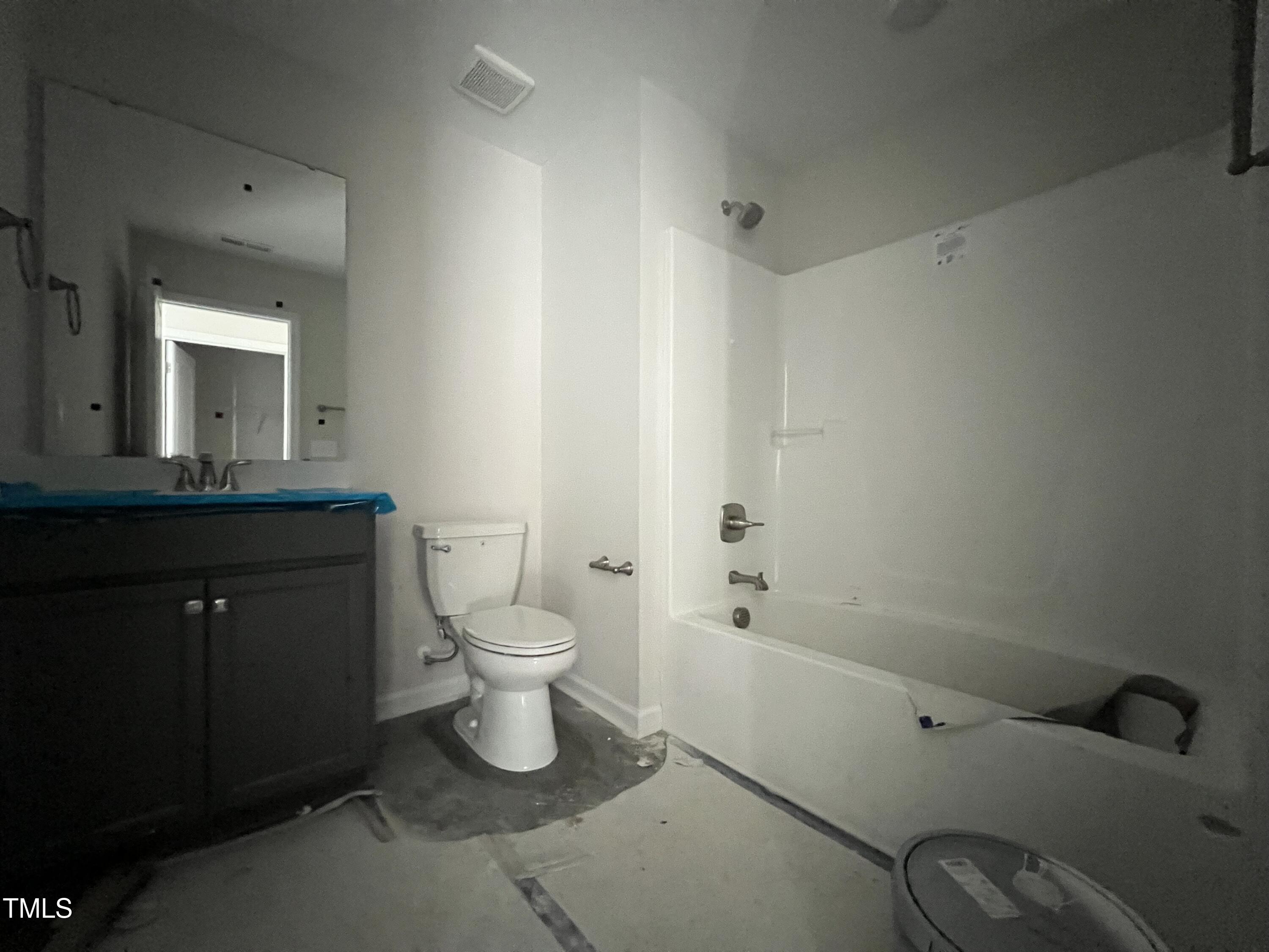 132 Dalton Drive Benson, NC 27504 - Photo 8 of 16 a bathroom with a granite countertop sink toilet and shower