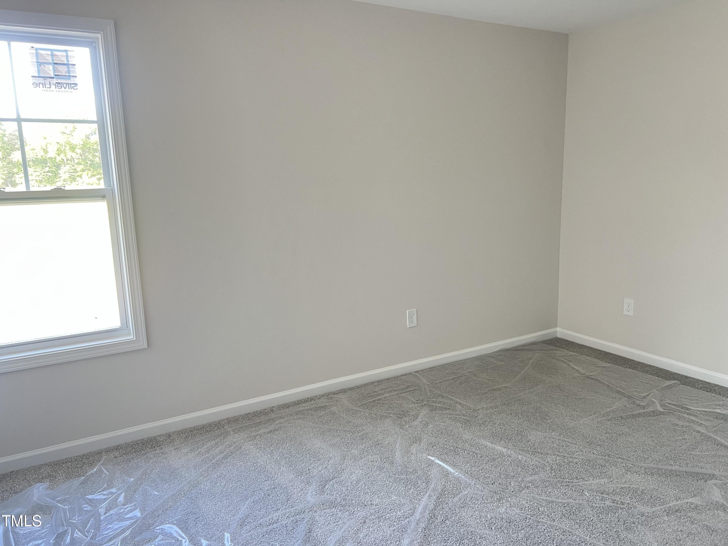 132 Dalton Drive Benson, NC 27504 - Photo 10 of 16 an empty room with a window