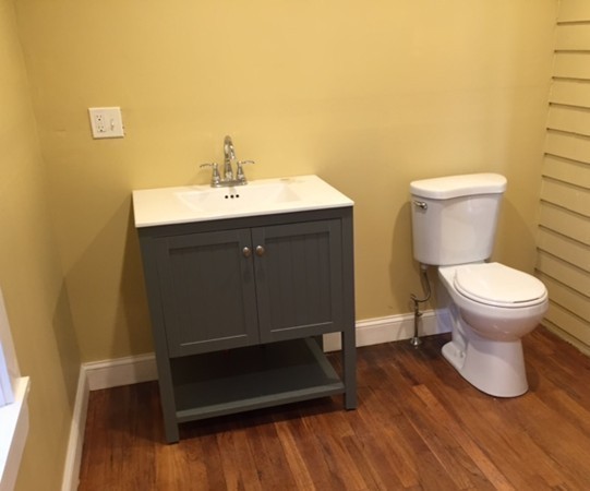 342 Franklin Street Framingham, MA 01702 - Photo 11 of 17 a bathroom with a sink toilet and vanity