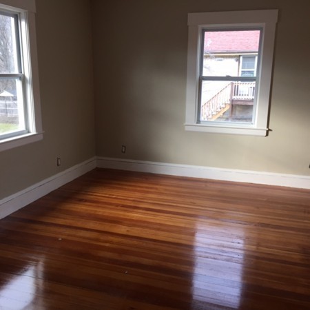 342 Franklin Street Framingham, MA 01702 - Photo 15 of 17 an empty room with wooden floor and windows