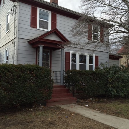 342 Franklin Street Framingham, MA 01702 - Photo 3 of 17 a front view of a house with a garden