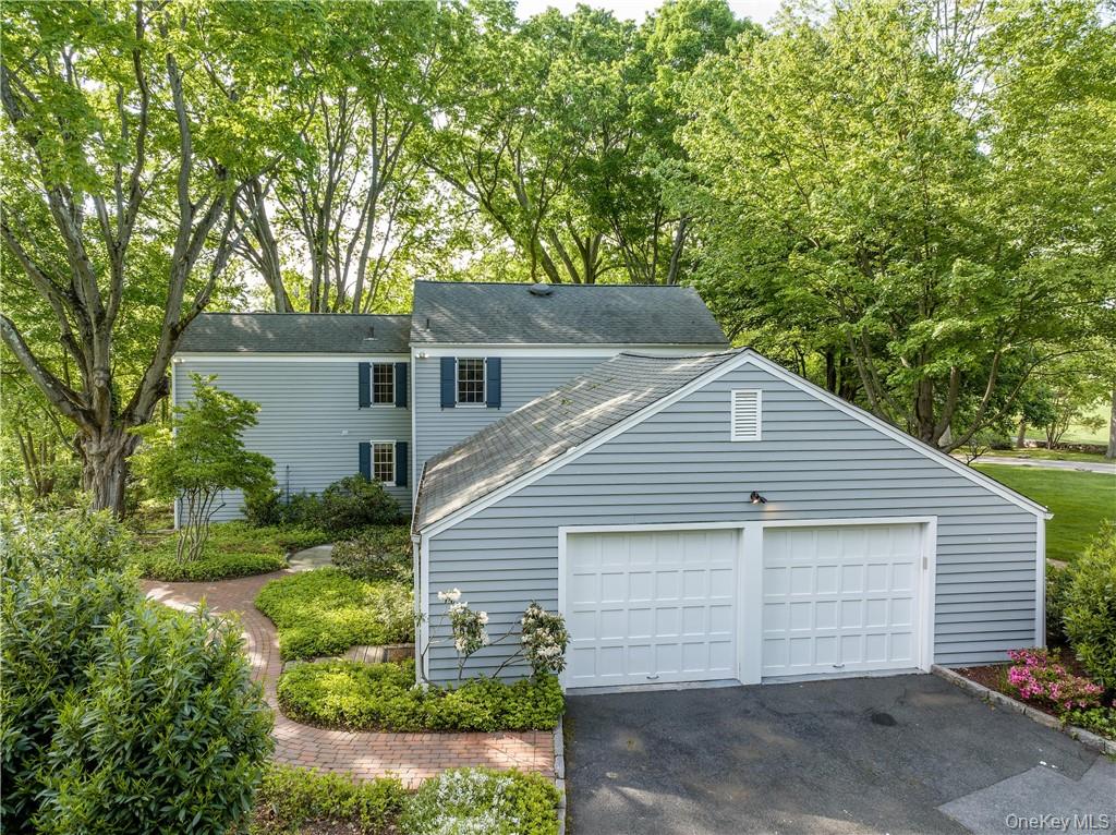 11 Sunset Lane Rye, NY 10580 - Photo 32 of 36 Generous two car garage with an area for bikes, with a storage area above.