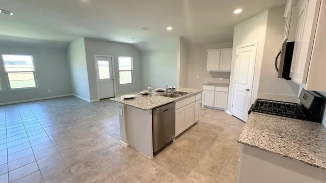 a front view of a house with a garden and porch
