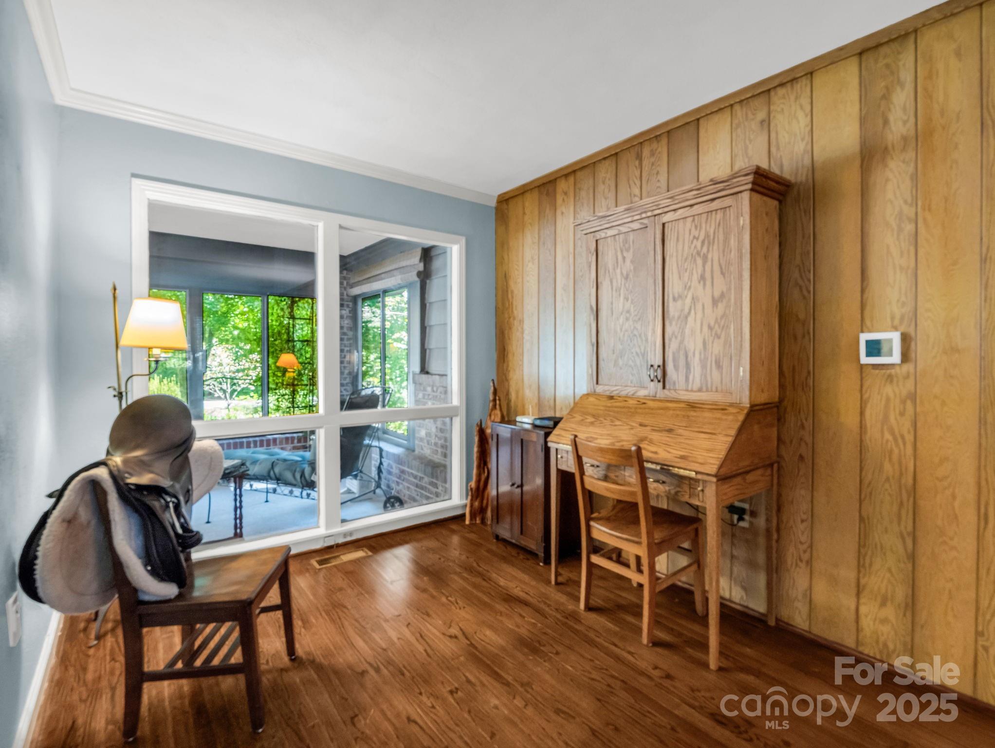 821 Warrior Drive Tryon, NC 28782 - Photo 11 of 44 a view of a livingroom with furniture window and wooden floor