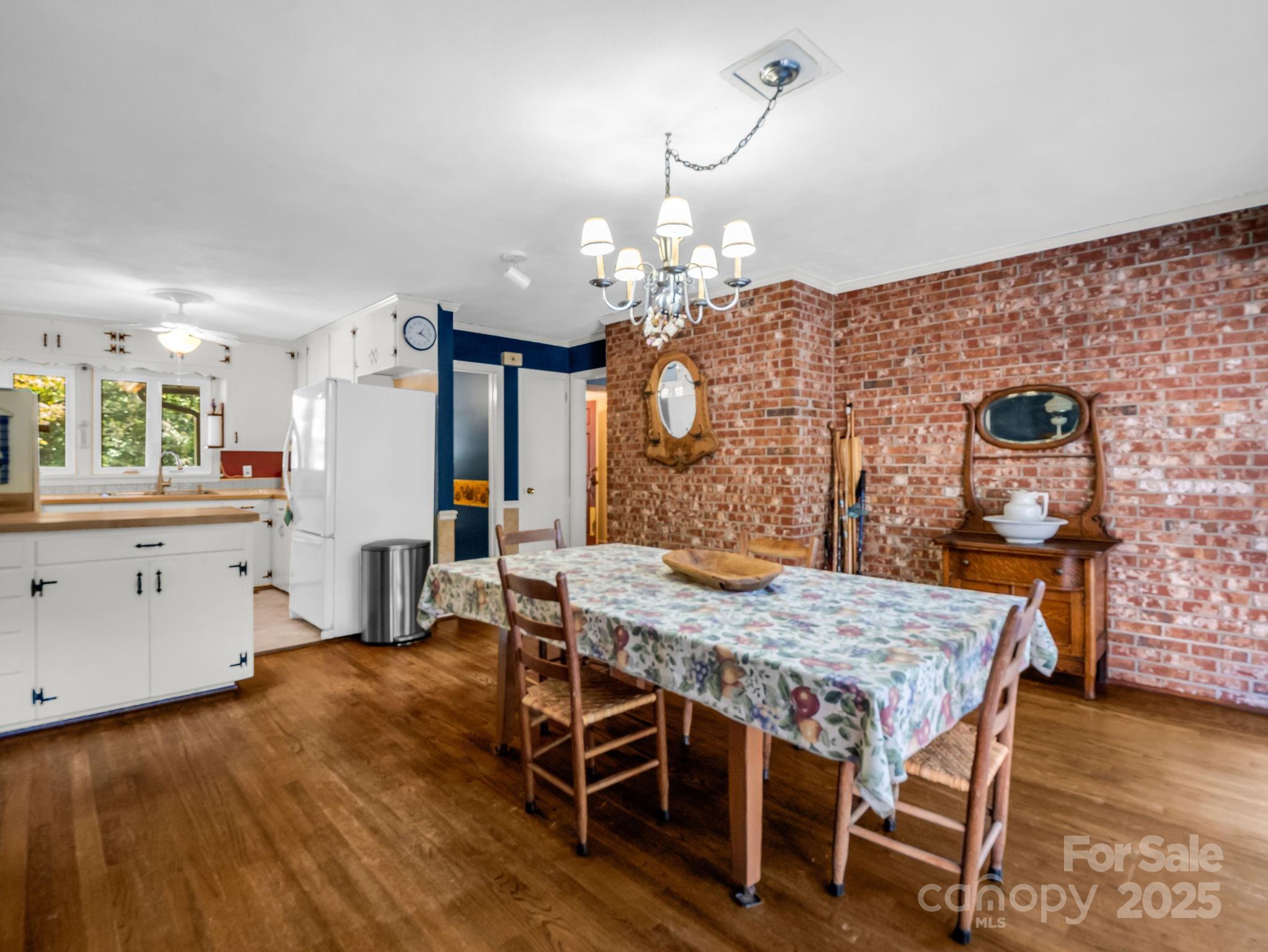 821 Warrior Drive Tryon, NC 28782 - Photo 14 of 44 a kitchen with a table and chairs in it