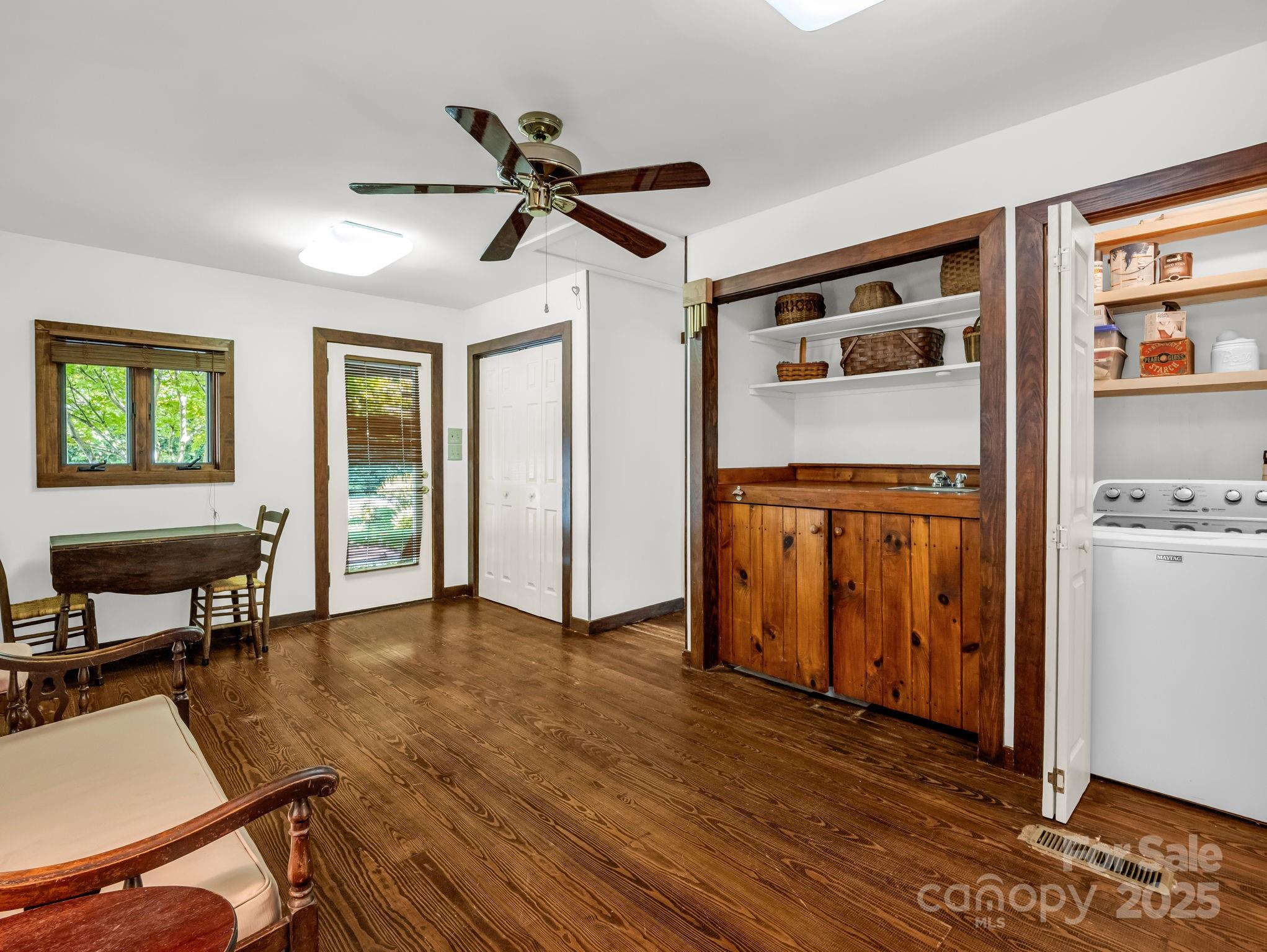821 Warrior Drive Tryon, NC 28782 - Photo 18 of 44 a living room with stainless steel appliances kitchen island granite countertop furniture and a window