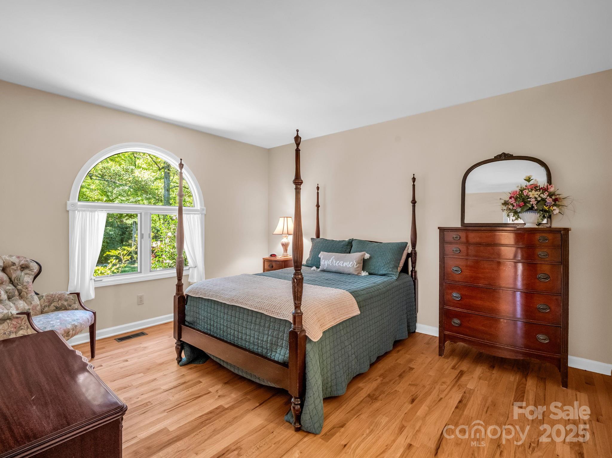 821 Warrior Drive Tryon, NC 28782 - Photo 21 of 44 a bed room with a bed and a dresser