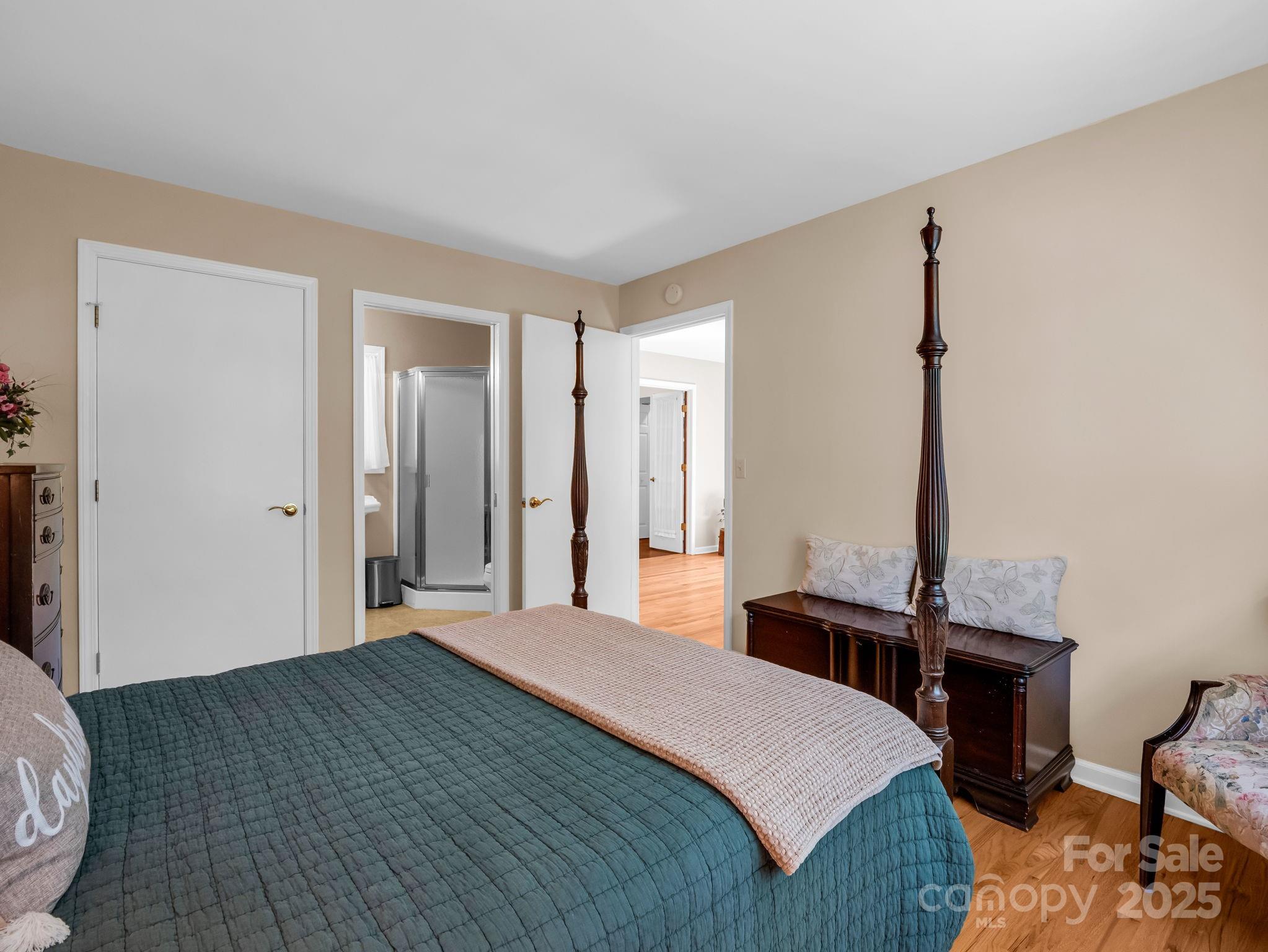 821 Warrior Drive Tryon, NC 28782 - Photo 22 of 44 a bedroom with a bed and a table