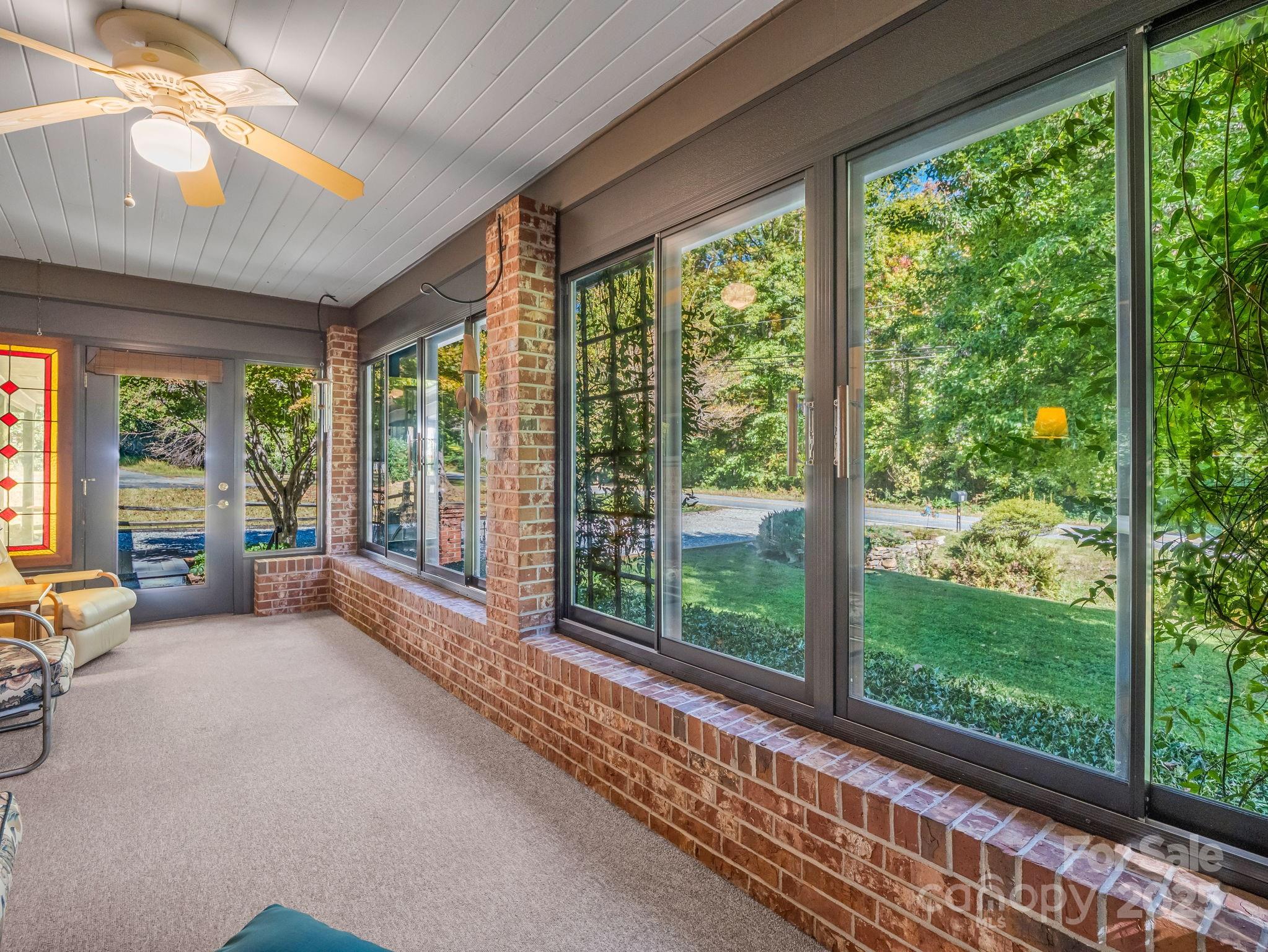 821 Warrior Drive Tryon, NC 28782 - Photo 27 of 44 a living room with furniture and windows