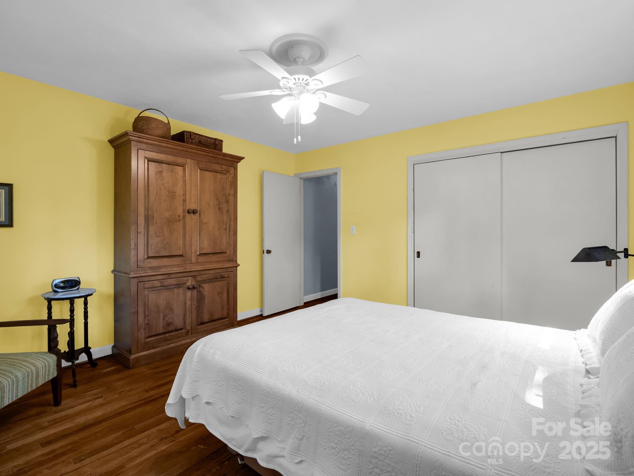 821 Warrior Drive Tryon, NC 28782 - Photo 30 of 44 a bedroom with a bed and wooden floor