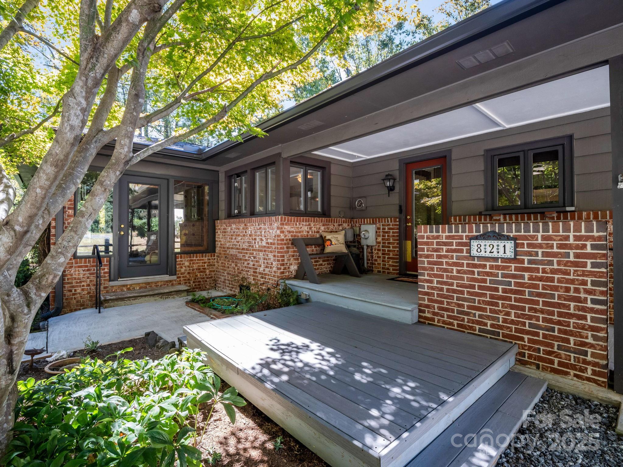 821 Warrior Drive Tryon, NC 28782 - Photo 3 of 44 a front view of a house with a large window