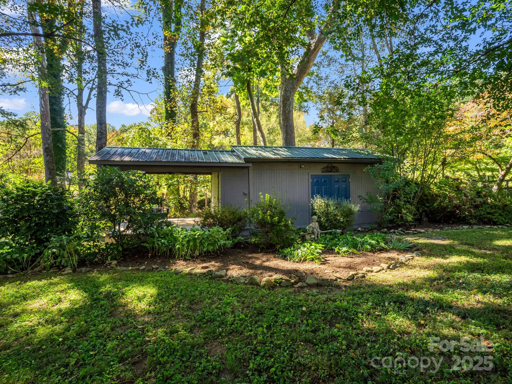 821 Warrior Drive Tryon, NC 28782 - Photo 38 of 44 a view of a house with a yard