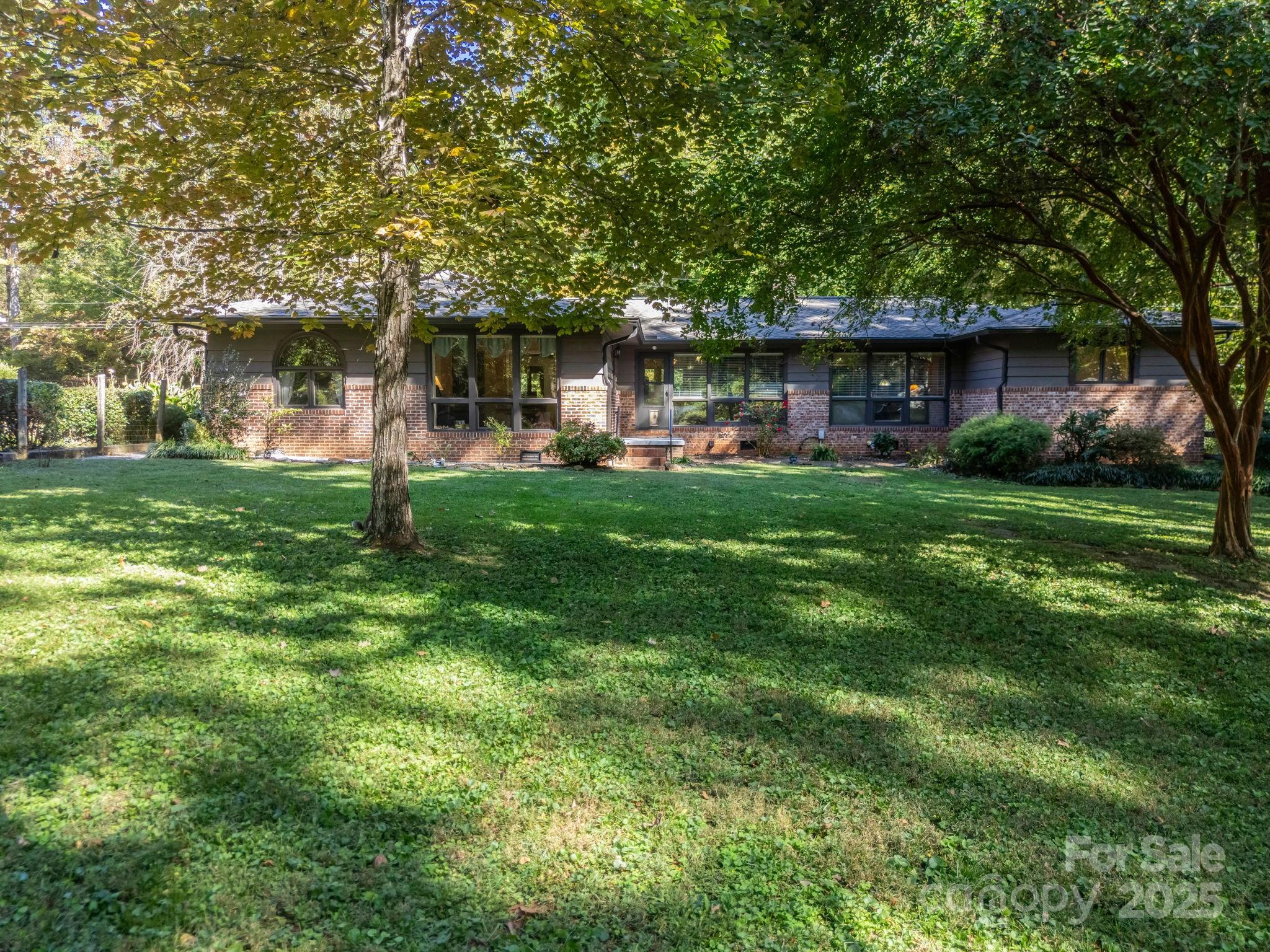 821 Warrior Drive Tryon, NC 28782 - Photo 40 of 44 a front view of a house with garden