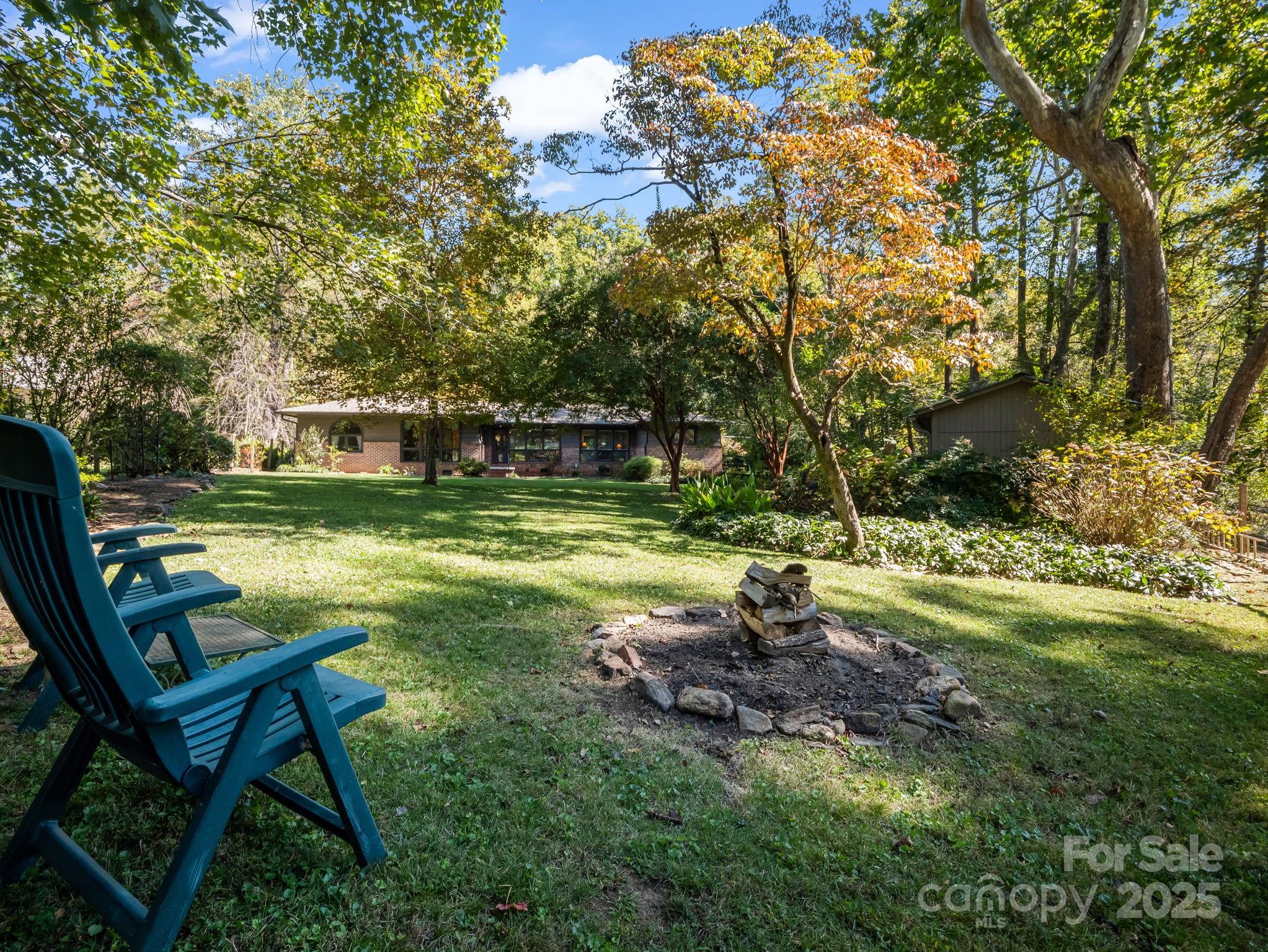 821 Warrior Drive Tryon, NC 28782 - Photo 5 of 44 a view of a backyard with swimming pool