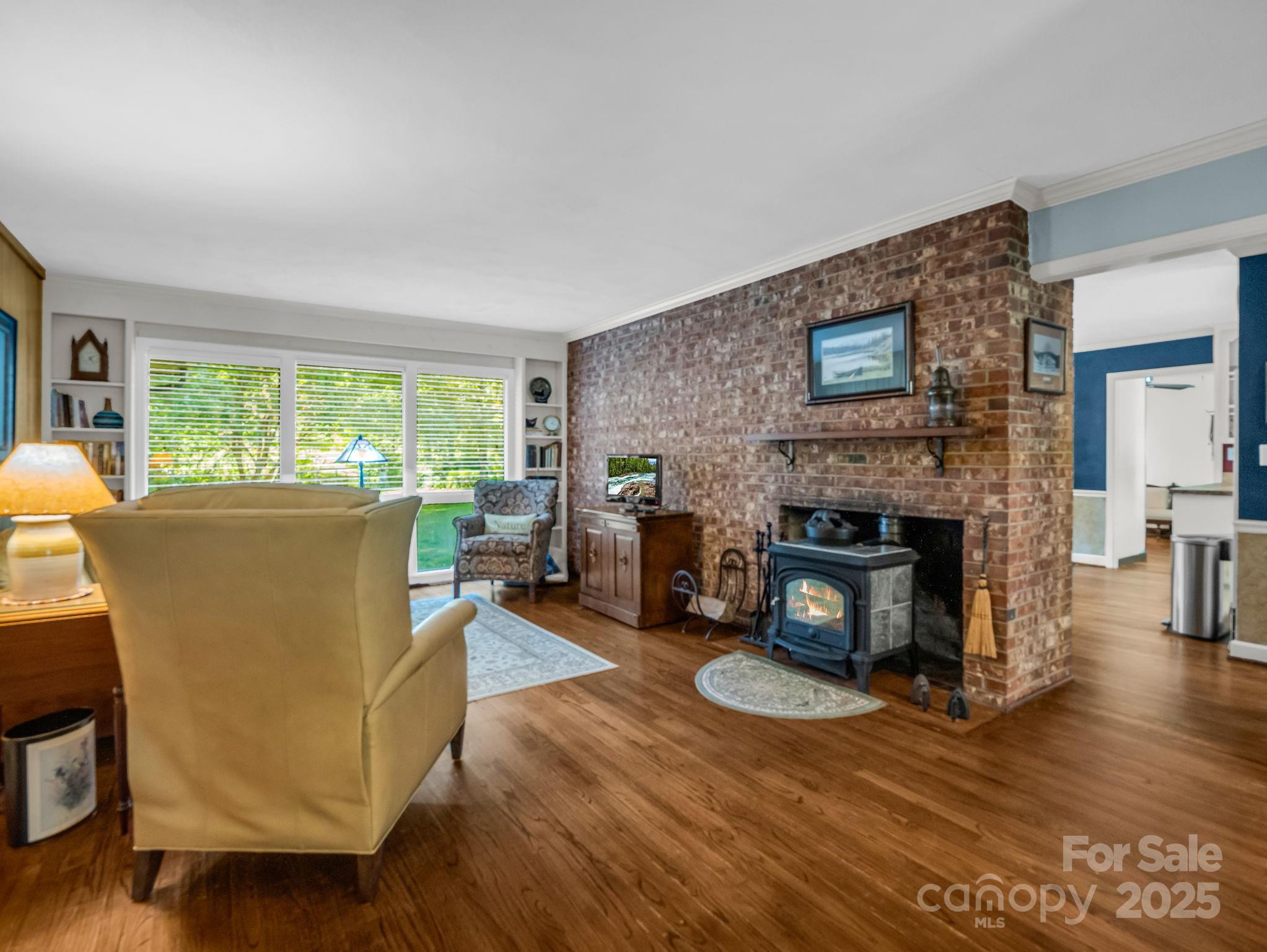 821 Warrior Drive Tryon, NC 28782 - Photo 9 of 44 a living room with furniture and a fireplace