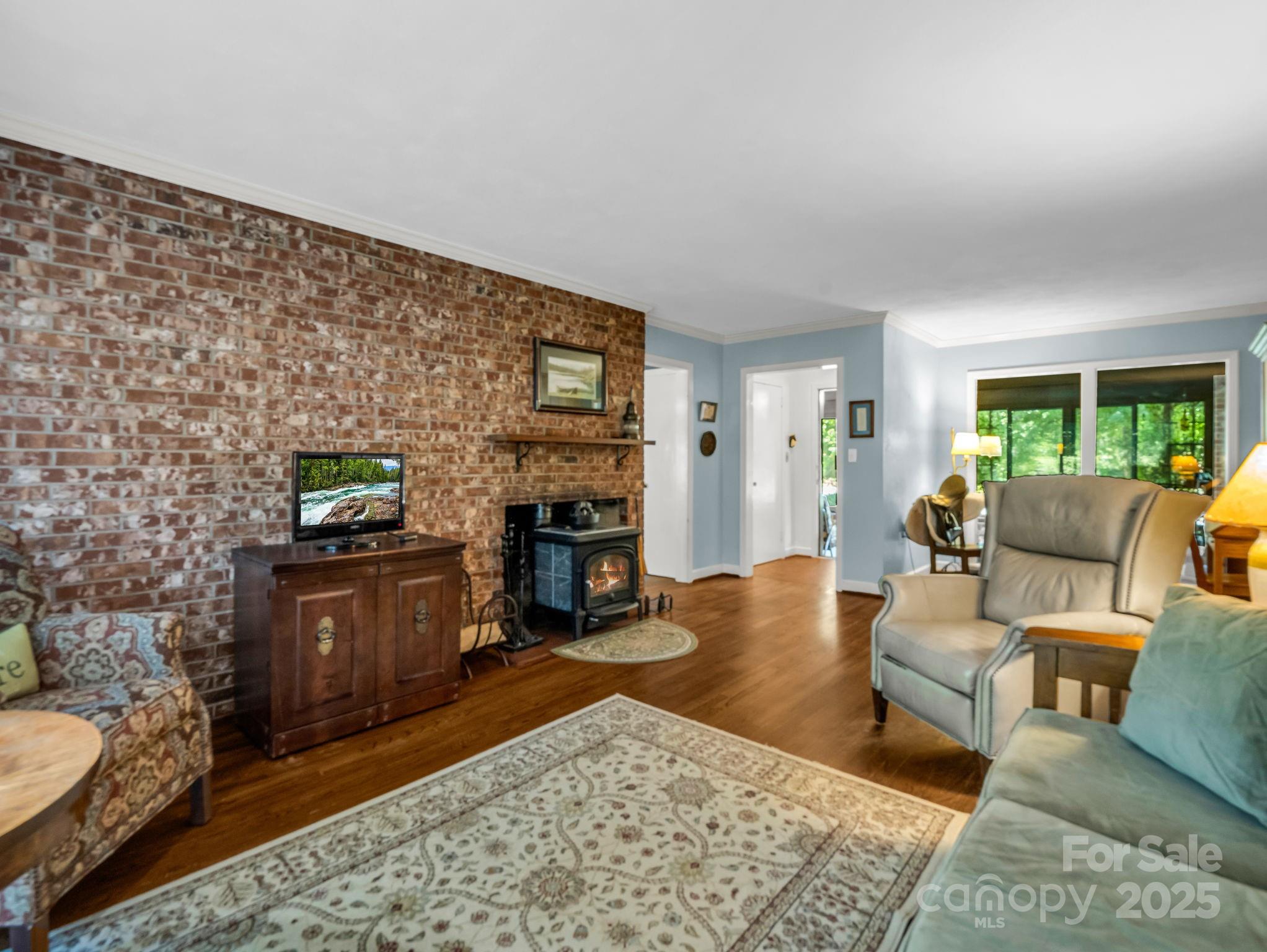 821 Warrior Drive Tryon, NC 28782 - Photo 10 of 44 a living room with furniture and a fireplace