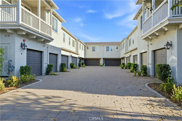 a view of a brick building with many windows