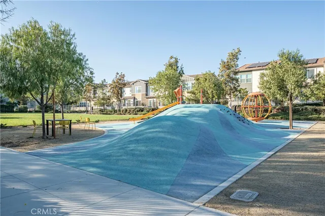 a view of a swimming pool with an outdoor space and seating area
