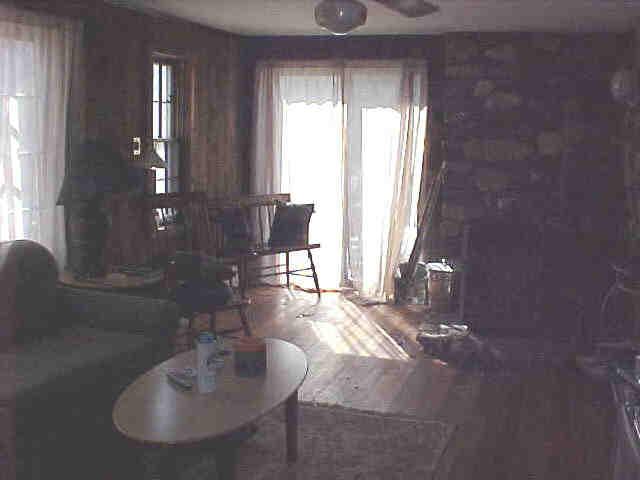 42 Curtin Road Peru, MA 01235 - Photo 5 of 6 a living room with furniture and a chandelier