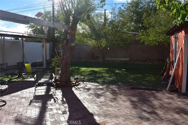 a view of a couches under an umbrella