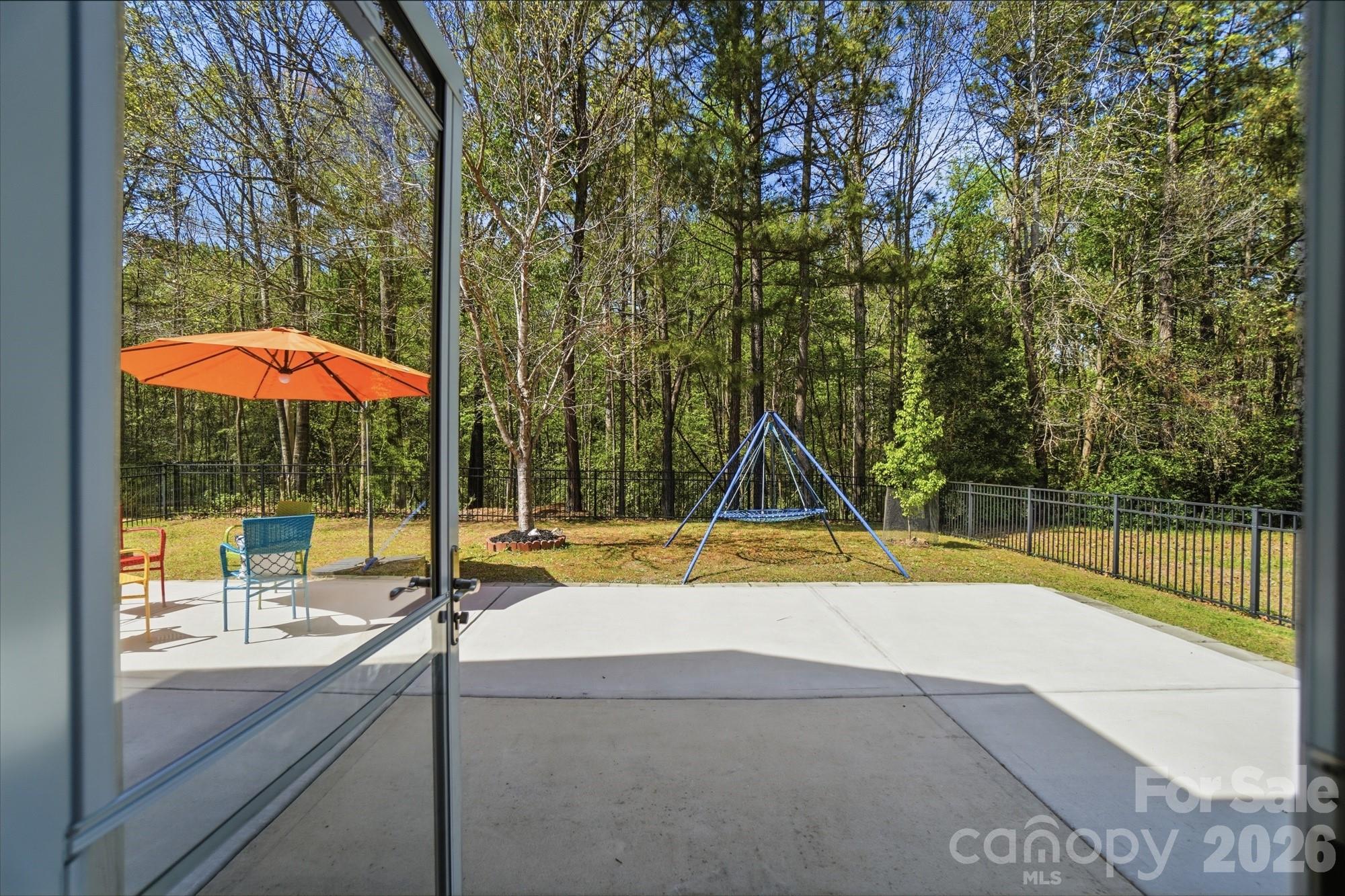 2153 Bluebell Way Tega Cay, SC 29708 - Photo 44 of 48 a view of pool with a small yard and a large tree