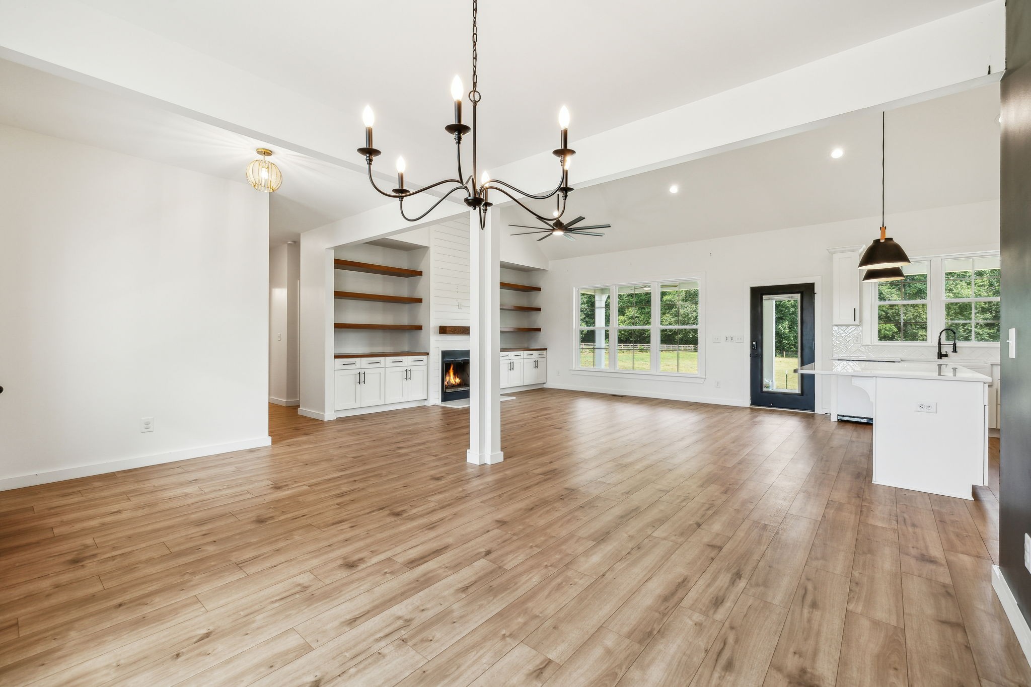 268 Dink Rut Road Portland, TN 37148 - Photo 12 of 62 a view of an empty room with a window and wooden floor