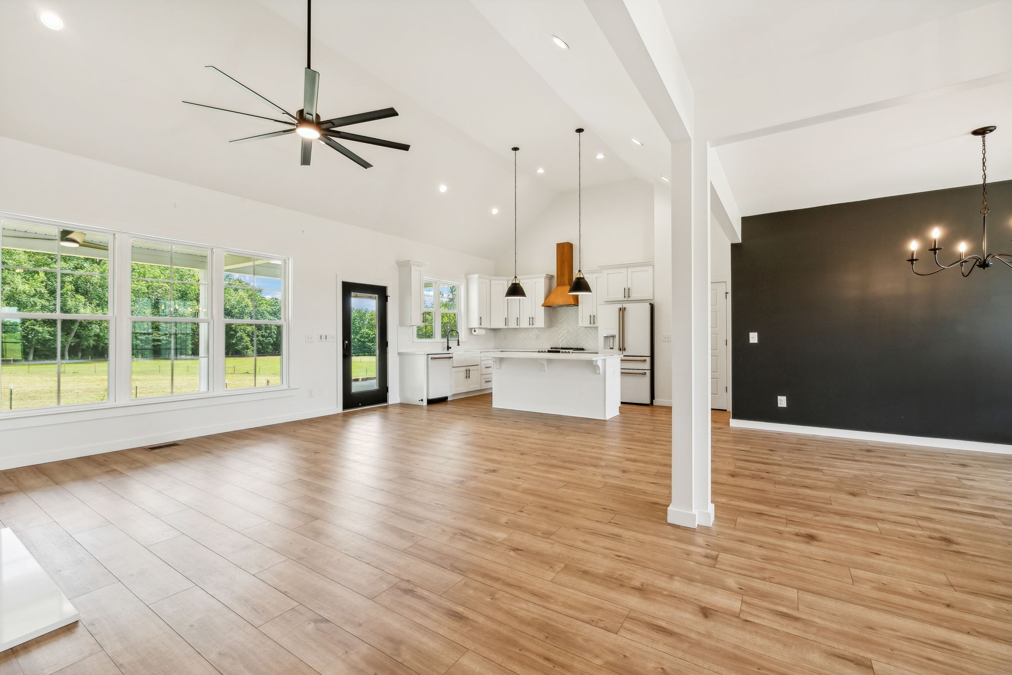 268 Dink Rut Road Portland, TN 37148 - Photo 13 of 62 a view of an empty room with wooden floor and a window