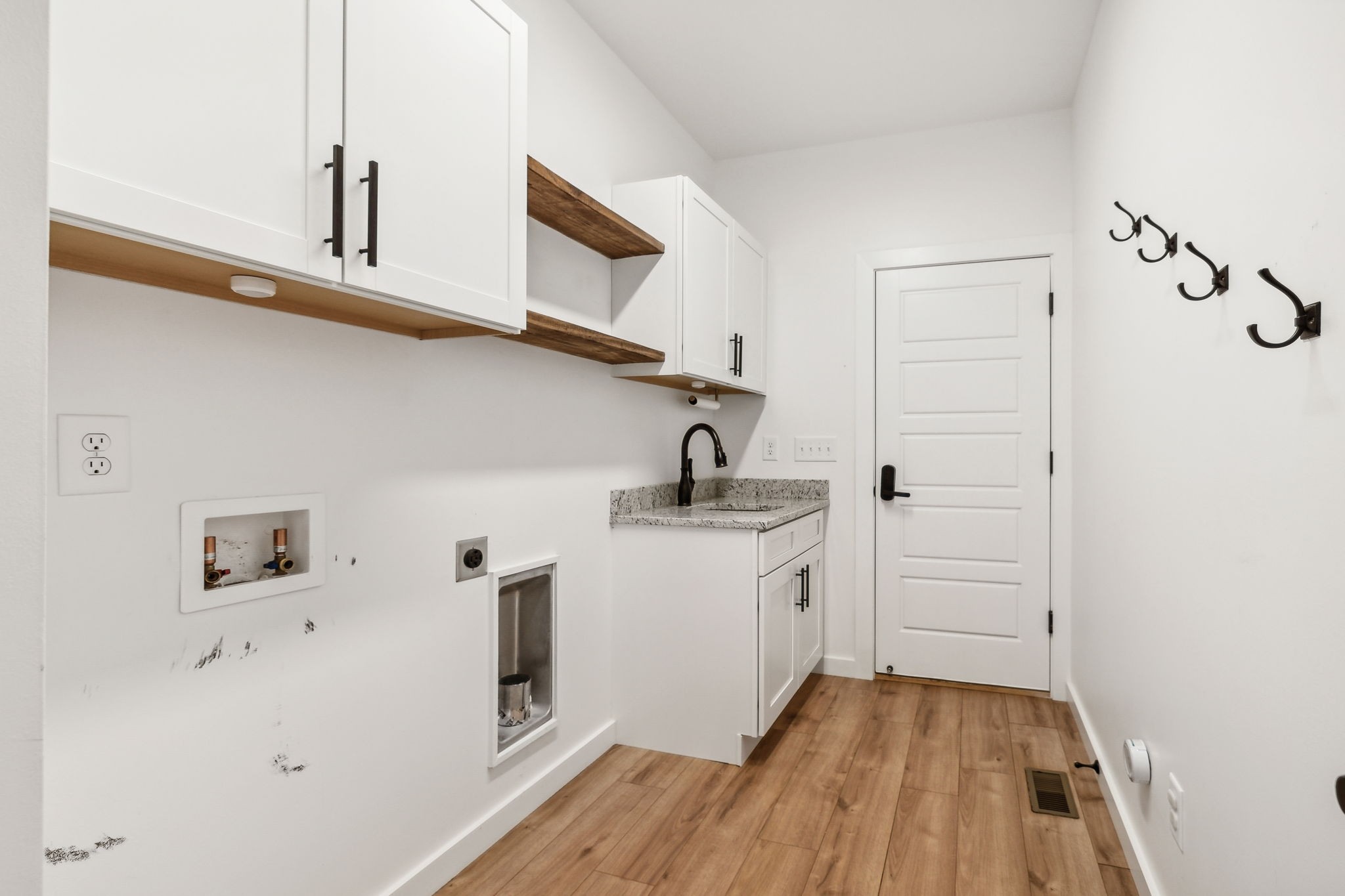 268 Dink Rut Road Portland, TN 37148 - Photo 18 of 62 a kitchen with white cabinets and sink