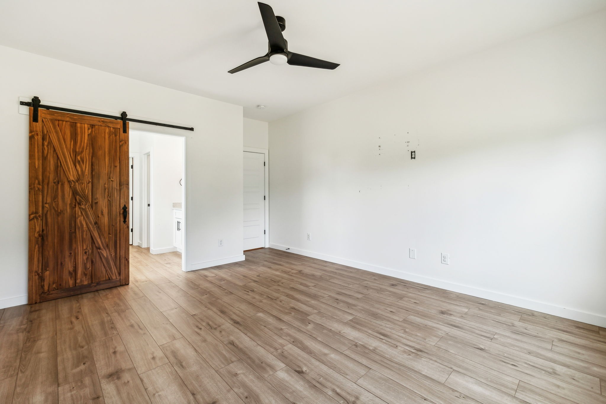268 Dink Rut Road Portland, TN 37148 - Photo 19 of 62 a view of an empty room with wooden floor