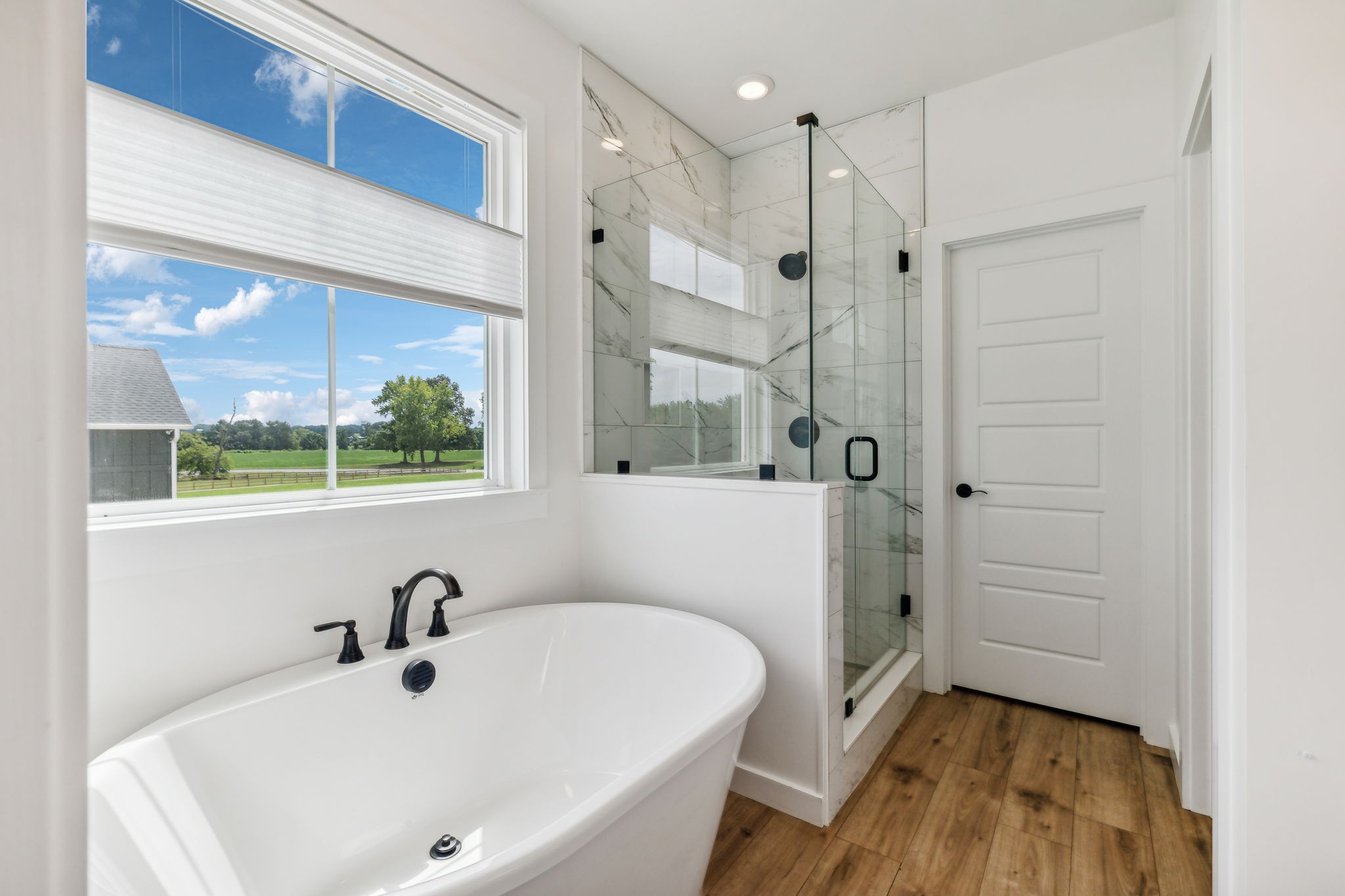 268 Dink Rut Road Portland, TN 37148 - Photo 20 of 62 a bathroom with a tub a sink and a window