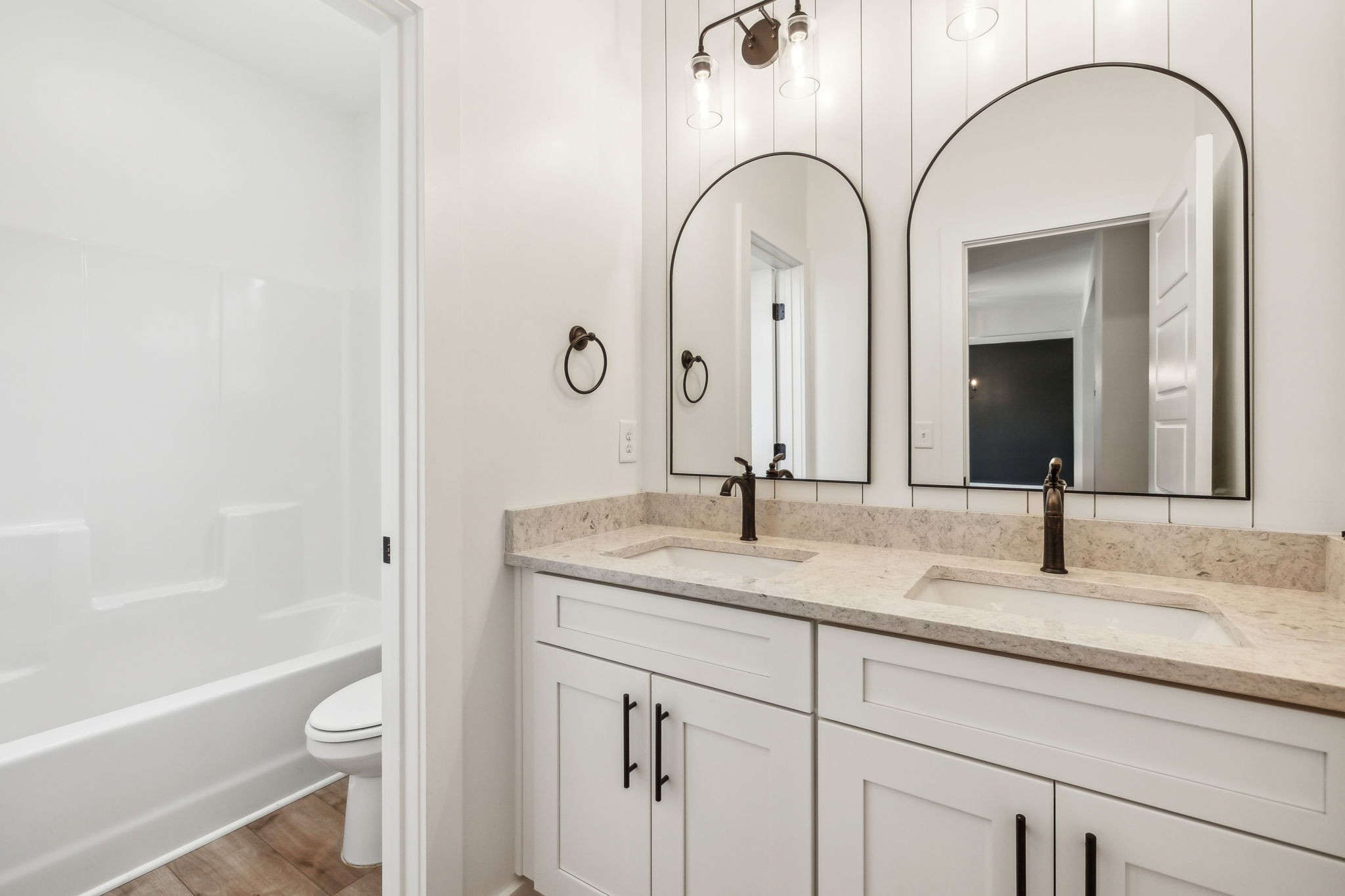 268 Dink Rut Road Portland, TN 37148 - Photo 24 of 62 a bathroom with a granite countertop sink a toilet and a bathtub