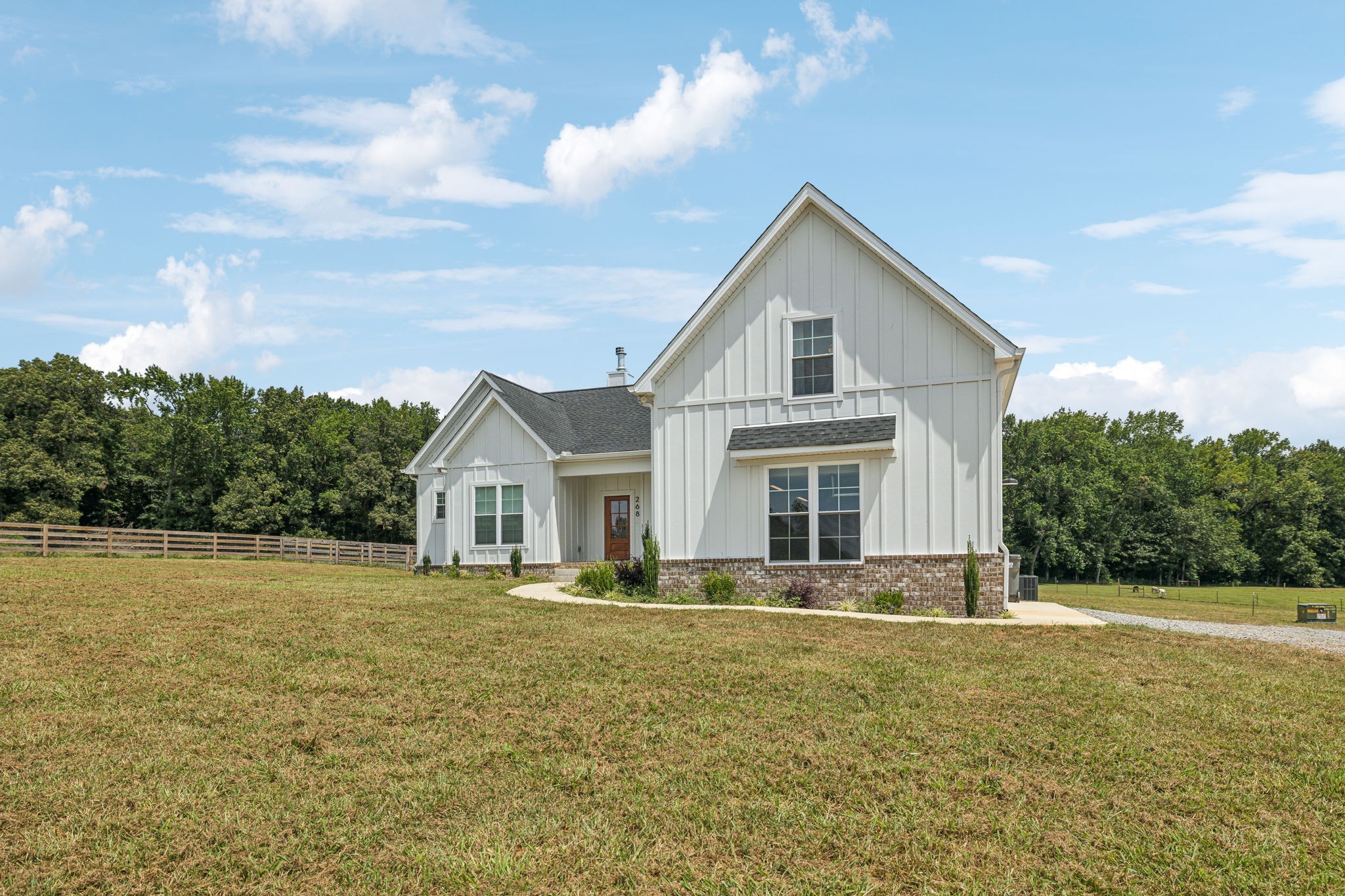 268 Dink Rut Road Portland, TN 37148 - Photo 3 of 62 a front view of house with yard and trees in the background