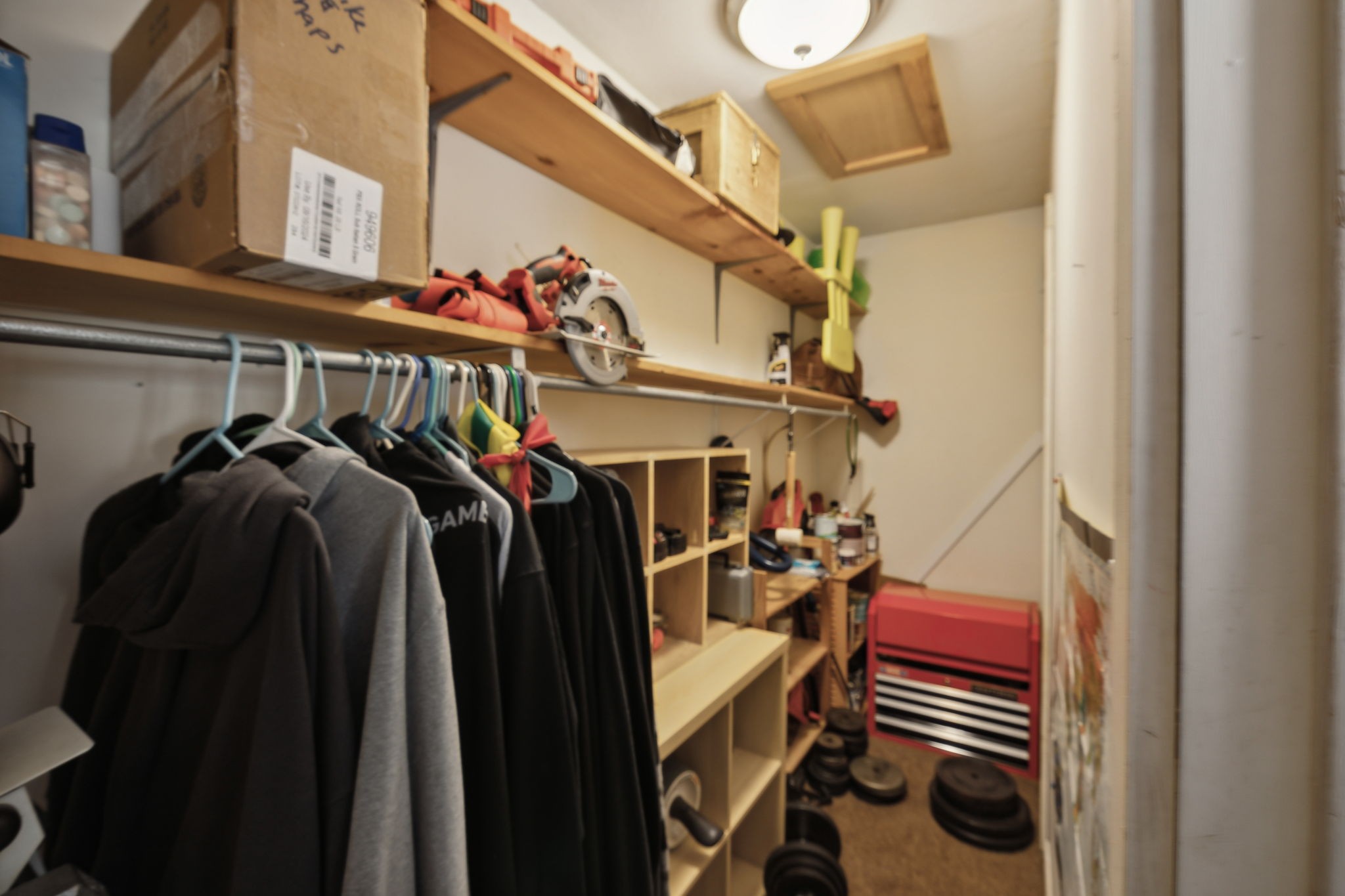 268 Dink Rut Road Portland, TN 37148 - Photo 43 of 62 a view of walk in closet with clothes and shoes