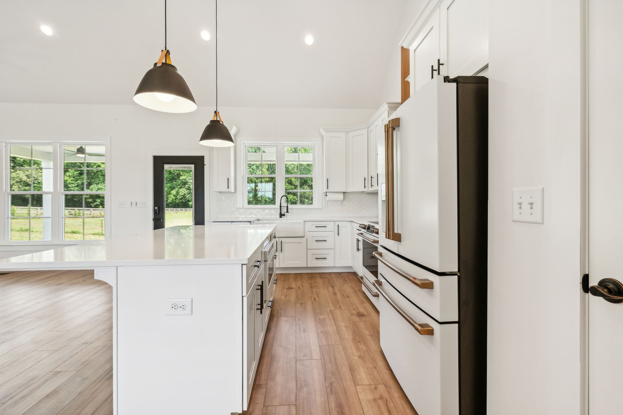 268 Dink Rut Road Portland, TN 37148 - Photo 8 of 62 a kitchen with stainless steel appliances granite countertop a refrigerator a oven a sink and a dining table with wooden floor
