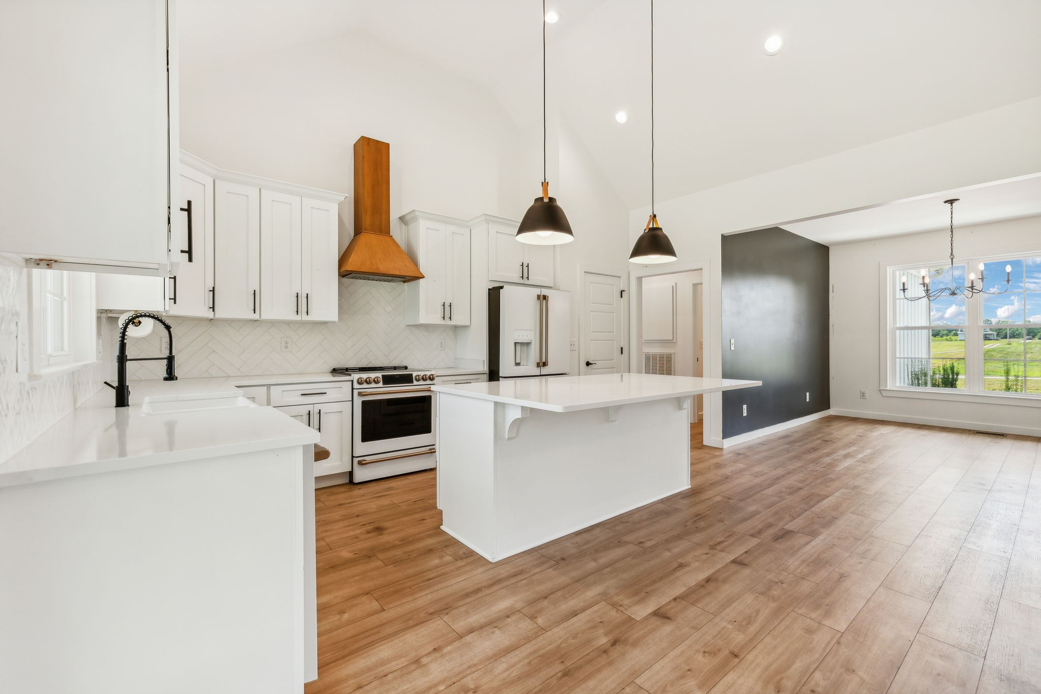 268 Dink Rut Road Portland, TN 37148 - Photo 9 of 62 a kitchen with stainless steel appliances granite countertop a sink a stove and a wooden floors