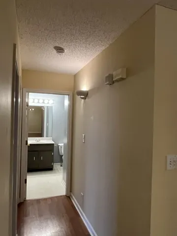a bathroom with a tub and glass door