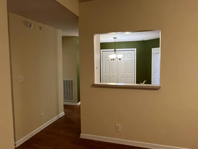 a view of a small space with wooden floor