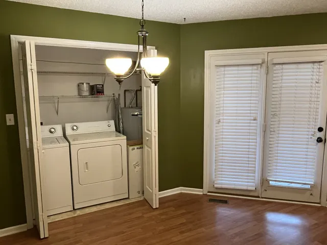 a view of a room with washer and dryer