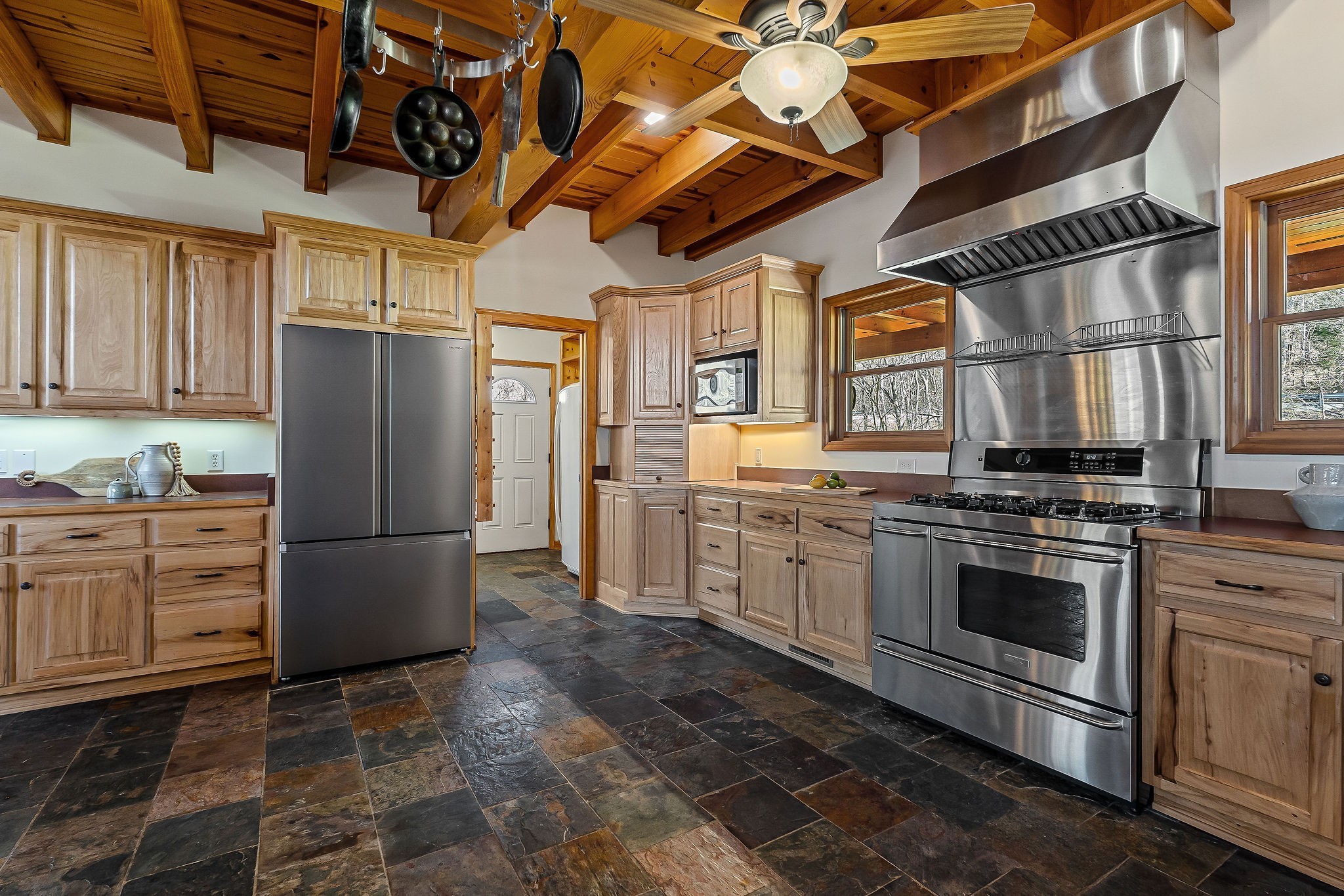 7775 Medley Amonette Road Buffalo Valley, TN 38548 - Photo 22 of 61 a kitchen with stainless steel appliances granite countertop a refrigerator and a stove top oven