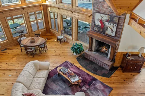 a living room with fireplace furniture and a flat screen tv