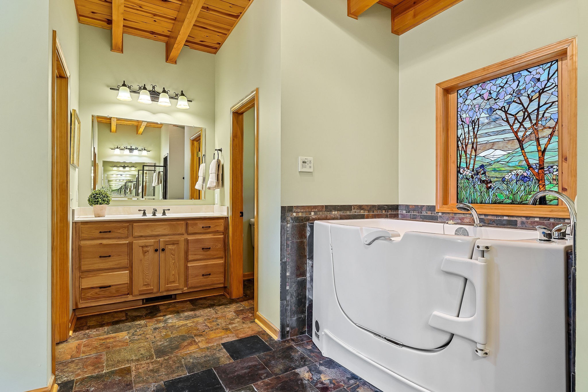 7775 Medley Amonette Road Buffalo Valley, TN 38548 - Photo 41 of 61 a bathroom with a sink a mirror and a bathtub